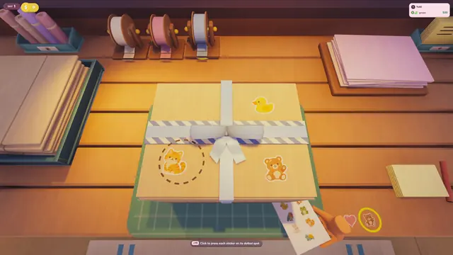A taped parcel with stickers next to a sticker sheet